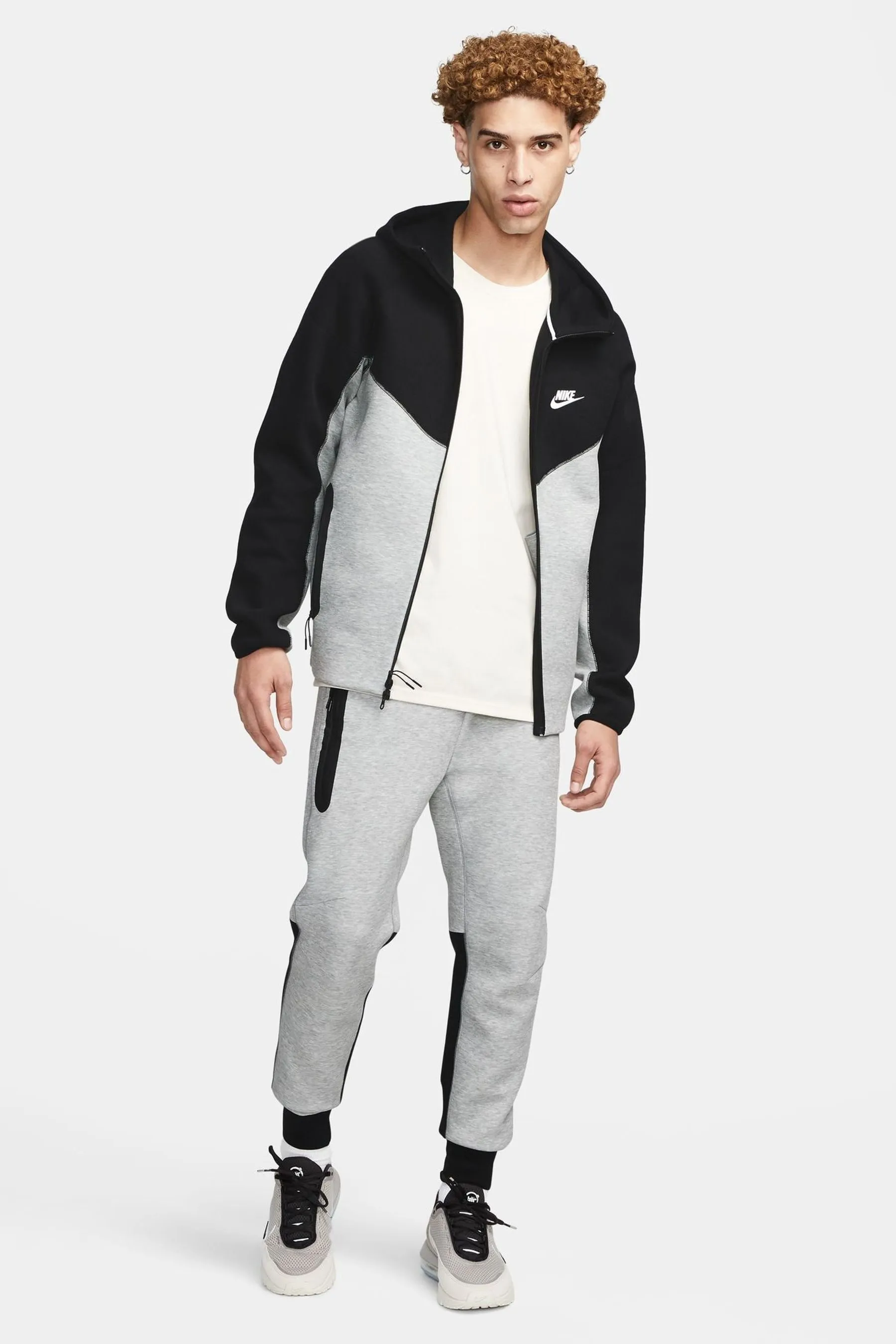 Nike - Pantaloni da jogging in tessuto tecnico e pile
